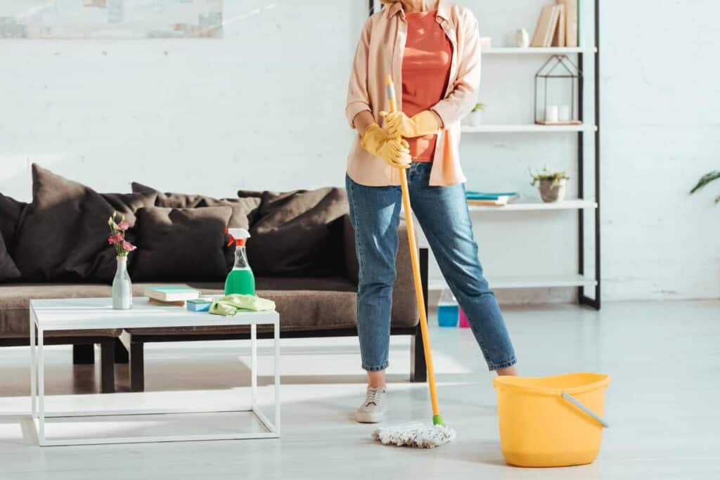 cropped view of woman cleaning house with mop and 2021 08 30 02 05 51 utc 1 1