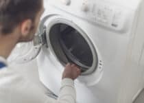 technician checking a washing machine at home 2021 09 02 16 30 58 utc 1