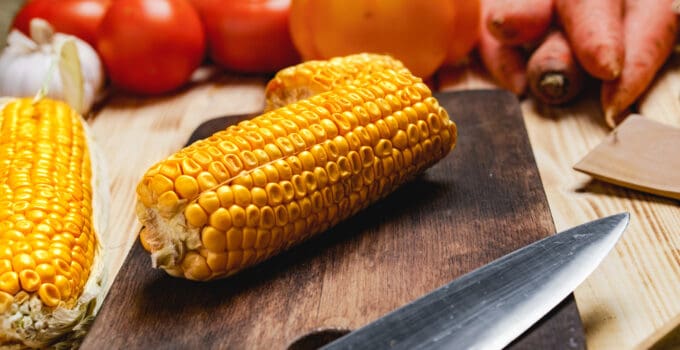 cobs of corn on wooden cutting board 2021 09 03 17 23 50 utc 1