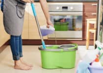housewife pouring floor cleaning liquid 2021 08 27 22 42 17 utc 1