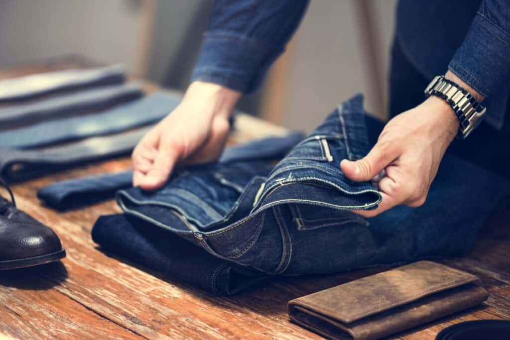 man folding jeans 2021 08 27 00 03 07 utc 1