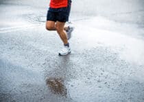 marathon runner in rain on city street 2021 08 26 22 35 13 utc 1