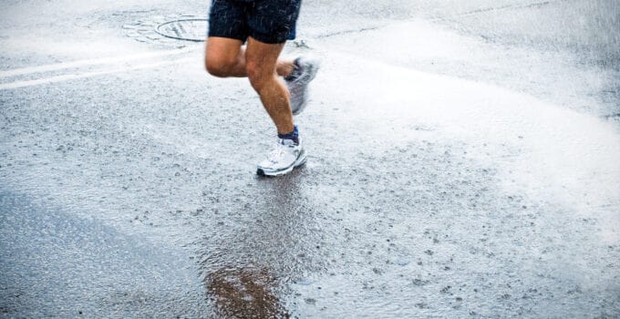 marathon runner in rain on city street 2021 08 26 22 35 13 utc 1