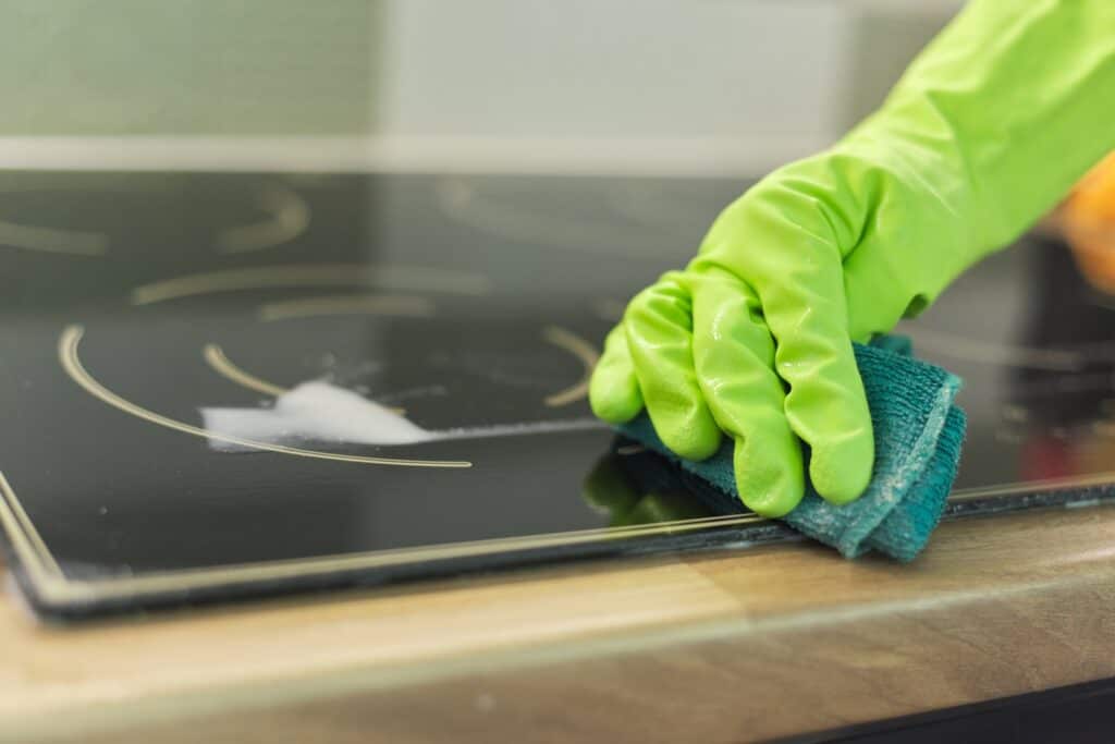 woman hands in gloves cleans kitchen electric cera 2022 03 16 22 12 43 utc 1