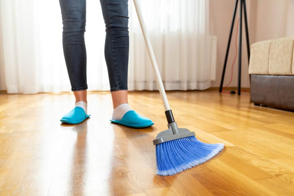 woman sweeping floor 2021 12 10 21 33 16 utc 1