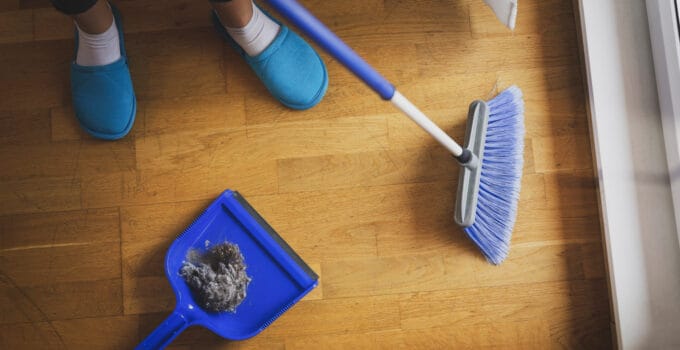 woman sweeping floor with a broom 2021 09 22 22 00 08 utc 1