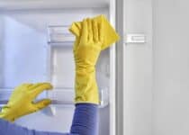 close up of caucasian woman cleaning fridge at hom 2022 04 12 19 48 55 utc 1 1