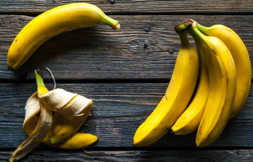 fresh bananas on wooden background fruit nature 2021 08 26 18 09 15 utc 1 1