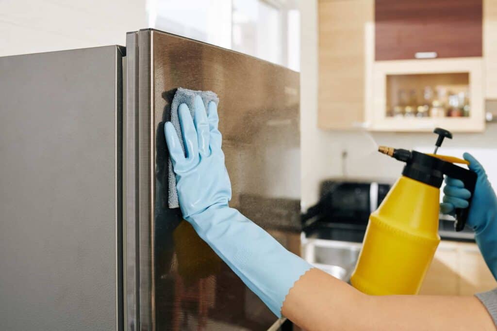 woman cleaning refrigerator 2021 08 27 22 42 11 utc 1 1