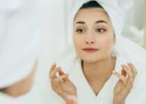 woman in mirror bathroom making makeup natural be 2021 08 27 23 59 18 utc 1 1