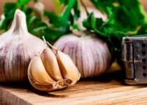 garlic with parsley on a wooden cutting board 2022 01 12 02 16 16 utc 1 1