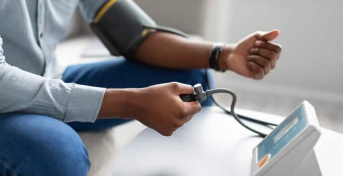 black man measuring arterial blood pressure having 2021 09 01 16 40 18 utc