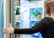 woman looking in open refrigerator 2021 09 01 15 06 03 utc 1 1