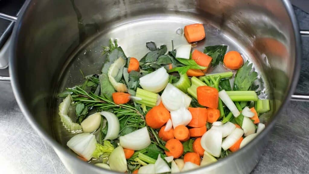 diced fresh vegetables and herbs in a saucepan 2021 08 26 22 34 26 utc