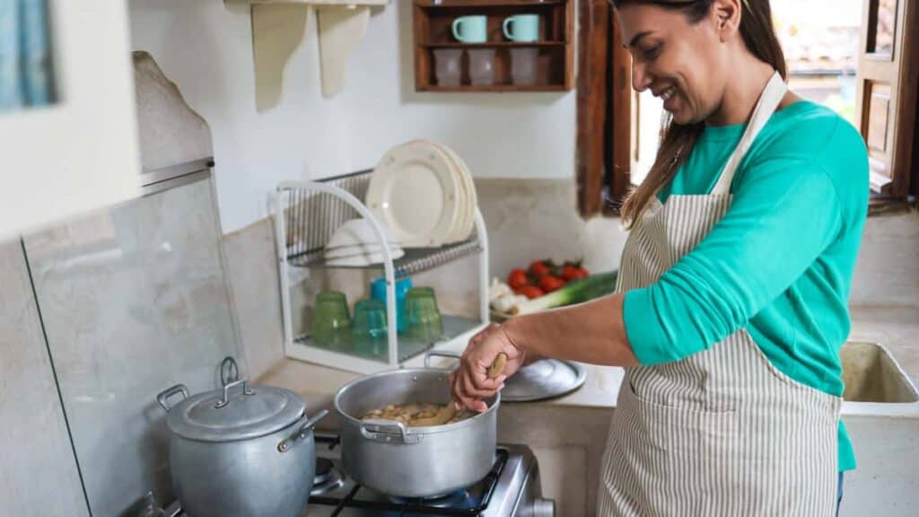 hispanic mature woman cooking dinner inside vintag 2021 09 03 06 38 54 utc