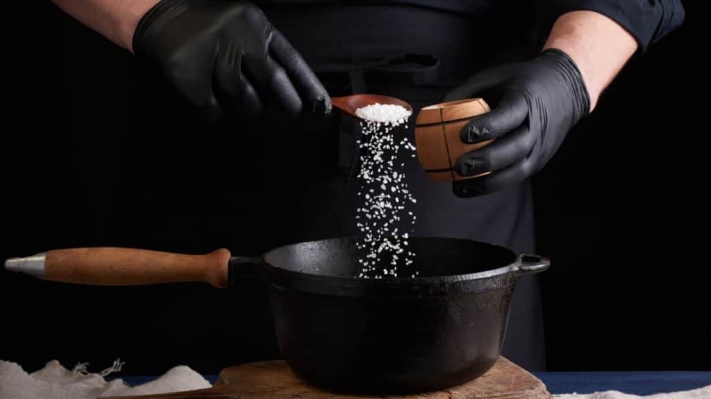 male cook in black uniform and latex gloves salt f 2022 05 01 23 54 39 utc
